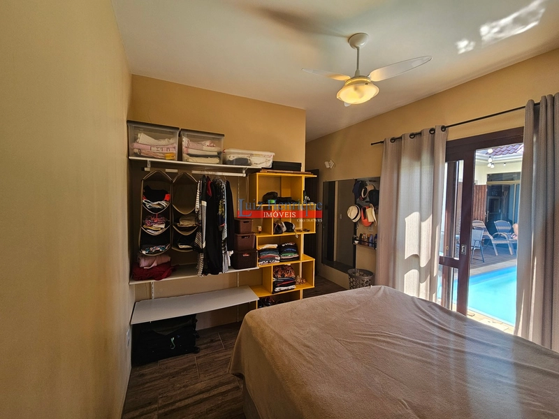 Com 2 terrenos e piscina: 40ª foto da galeria de imagens do imóvel