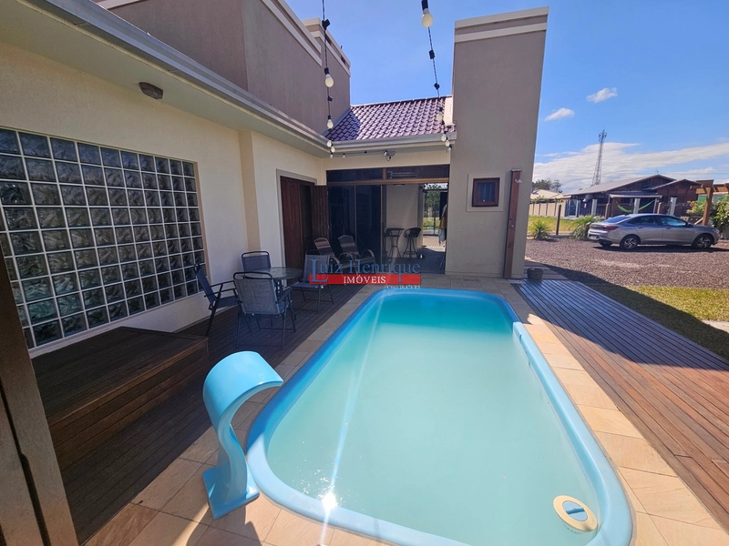 Com 2 terrenos e piscina: 50ª foto da galeria de imagens do imóvel