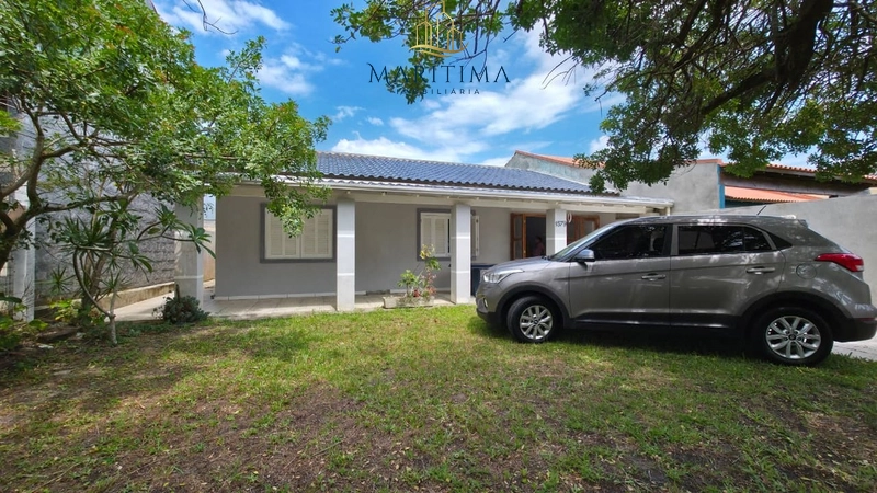 Casa com 03 dormitórios a poucos metros do Mar!: 2ª foto da galeria de imagens do imóvel