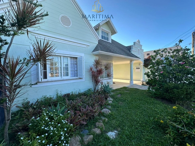 Casa estilo americana junto ao mar em Tramandaí: 1ª foto da galeria de imagens do imóvel