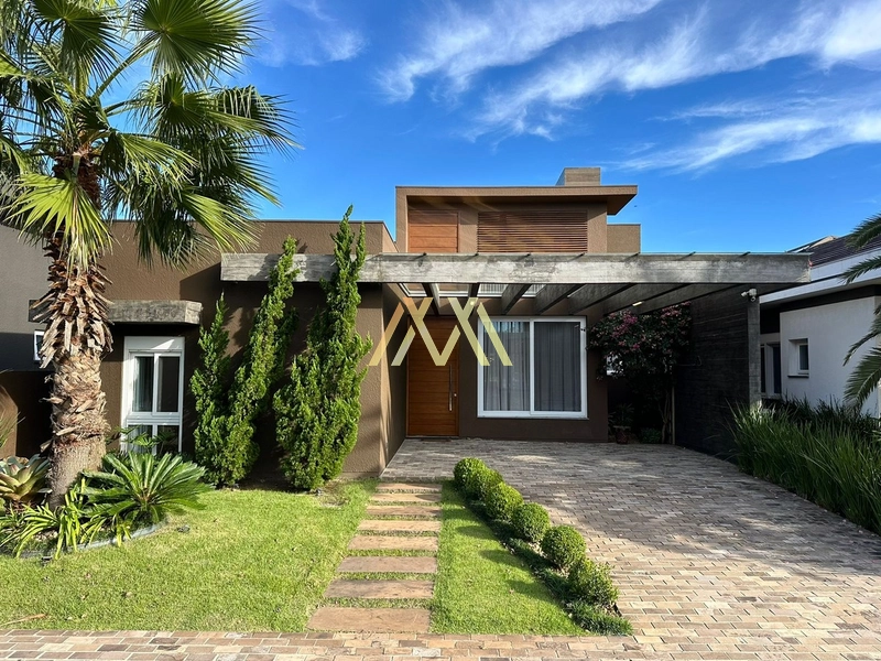 Casa beira lago à venda em condomínio em Capão da Canoa!: 1ª foto da galeria de imagens do imóvel
