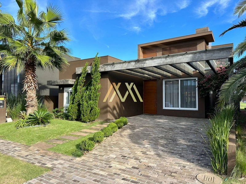 Casa beira lago à venda em condomínio em Capão da Canoa!: 2ª foto da galeria de imagens do imóvel