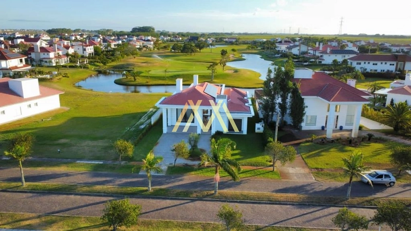 Casa beira lago à venda no condomínio Green Village em Xangri-Lá!: 3ª foto da galeria de imagens do imóvel