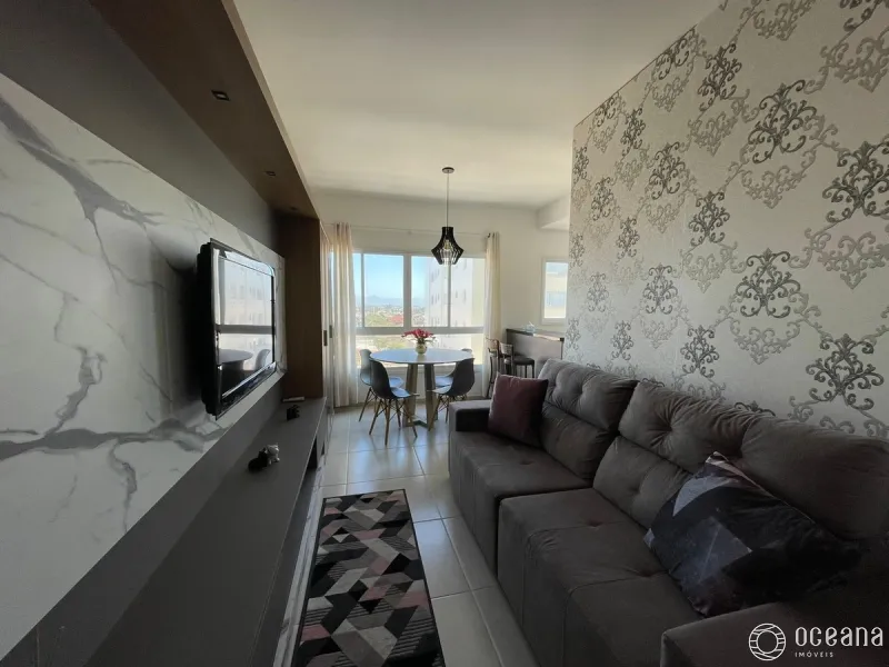 Apartamento com sacada integrada com churrasqueira na Zona Nova.: 2ª foto da galeria de imagens do imóvel