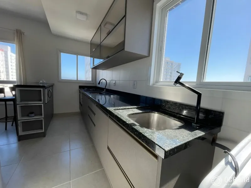 Apartamento com sacada integrada com churrasqueira na Zona Nova.: 5ª foto da galeria de imagens do imóvel