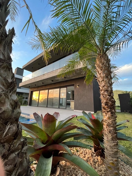 CASA  EM CONDOMÍNIO FECHADO / XANGRI-LÁ: 1ª foto da galeria de imagens do imóvel
