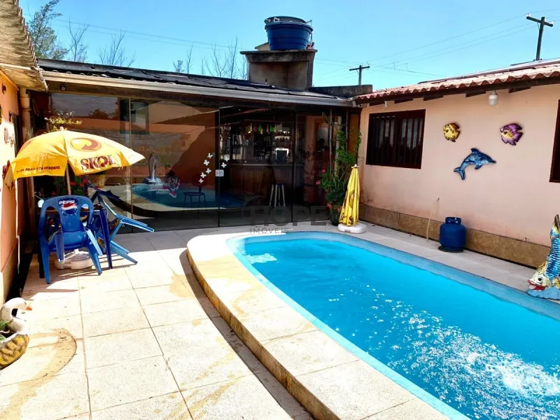 Casa ampla com piscina em Capão da Canoa: 2ª foto da galeria de imagens do imóvel