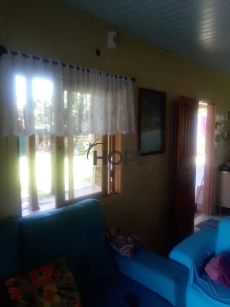 CASA DE MADEIRA COMPOSTA POR 2 DORMITÓRIOS EM XANGRI-LÁ!: 4ª foto da galeria de imagens do imóvel