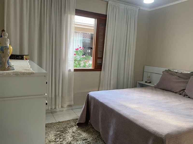 Casa com 3 dormitórios e área de churrasco em bairro  de Xangri-lá: 1ª foto da galeria de imagens do imóvel