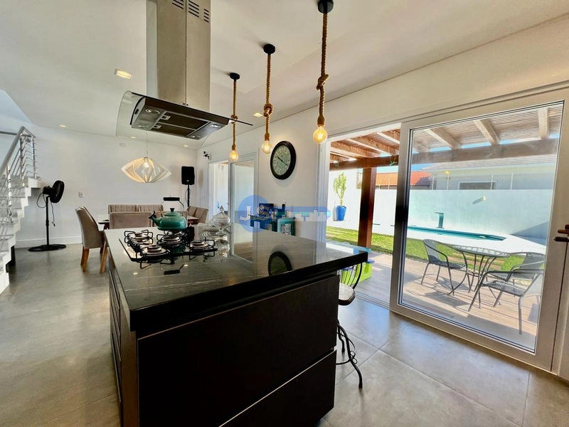 Excelente casa em Atlântida Sul: 2ª foto da galeria de imagens do imóvel