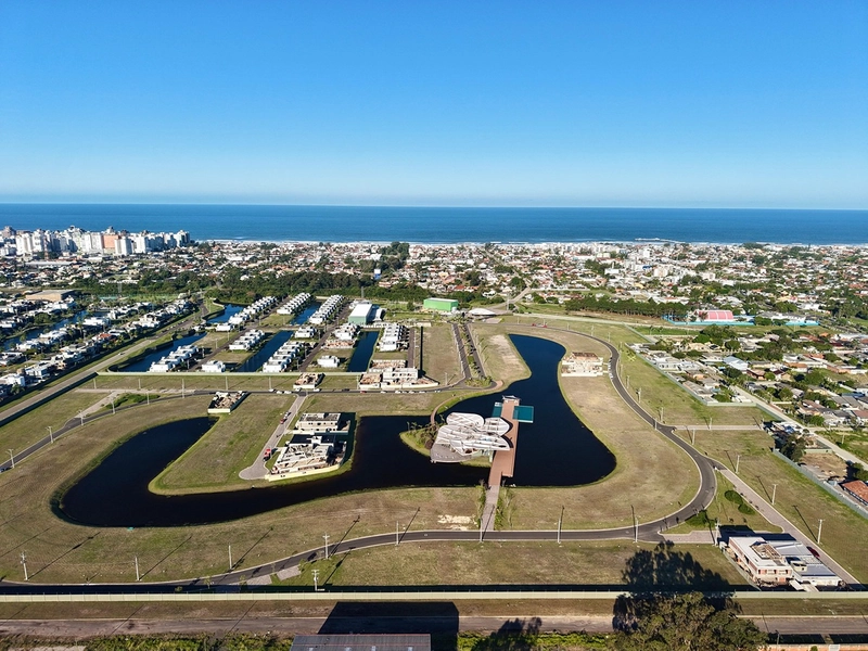 Lote/Terreno beira lago à venda no condomínio Lótus em Atlântida: 17ª foto da galeria de imagens do imóvel