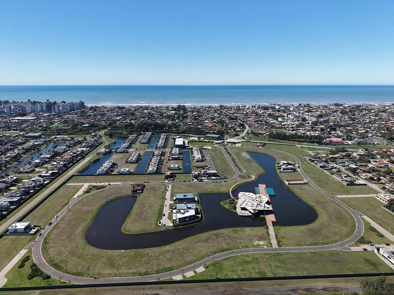 Lote/Terreno à venda no condomínio Lótus em Atlântida: 1ª foto da galeria de imagens do imóvel