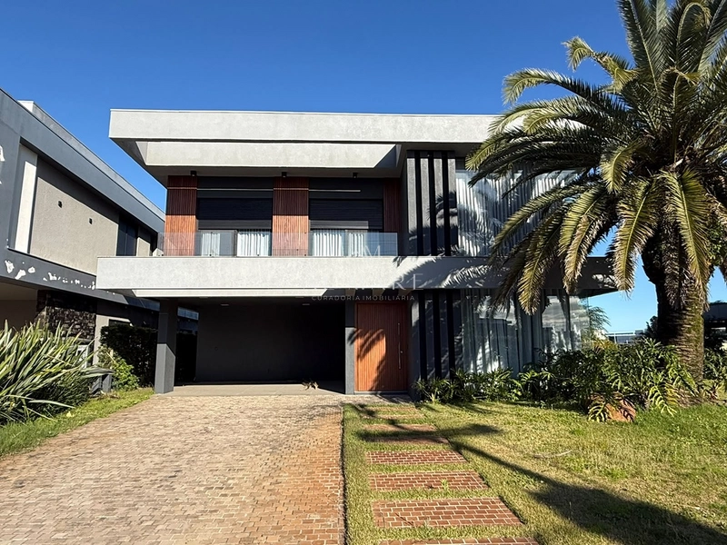 Casa beira lago com seis suítes mais lavabo ao lado da infra: 2ª foto da galeria de imagens do imóvel