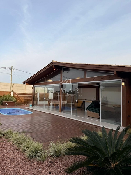 Casa Bairro com cinco dormitórios, mobiliada e com três vagas de garagem: 9ª foto da galeria de imagens do imóvel