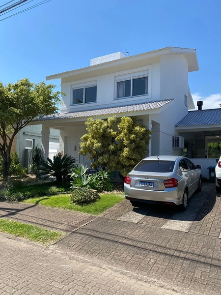 Conforto e integração: casa com 3 livings em condomínio exclusivo : 5ª foto da galeria de imagens do imóvel