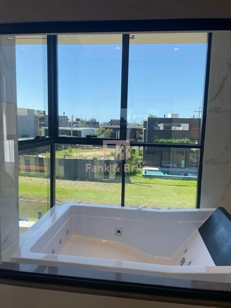 SOBRADO A VENDA EM CONDOMINIO FECHADO EM XANGRI-LÁ: 21ª foto da galeria de imagens do imóvel