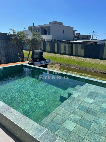 SOBRADO A VENDA EM CONDOMINIO FECHADO EM XANGRI-LÁ: 10ª foto da galeria de imagens do imóvel