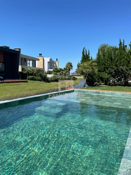 SOBRADO A VENDA EM CONDOMINIO FECHADO EM XANGRI-LÁ: 9ª foto da galeria de imagens do imóvel