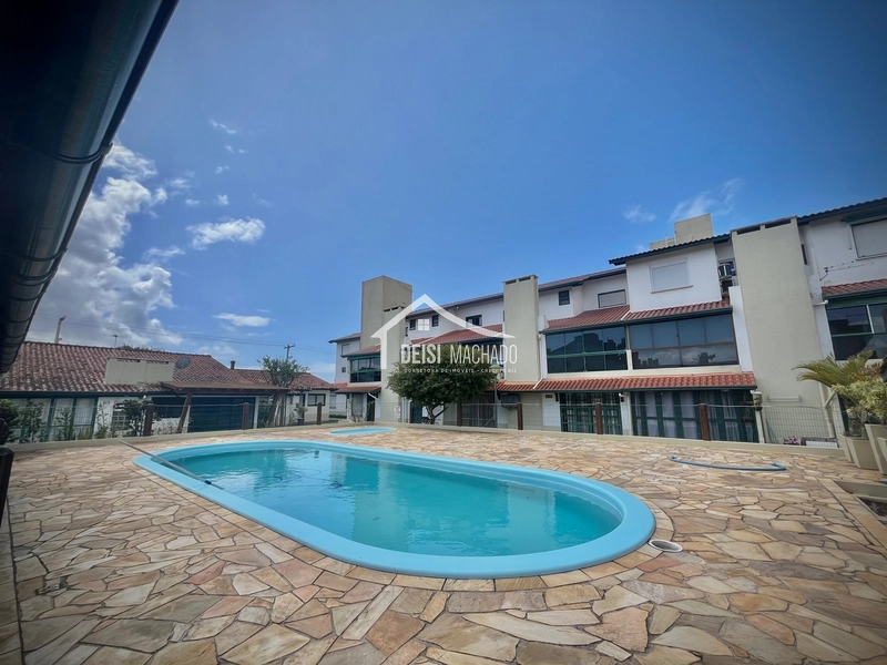 Apartamento térreo em prédio com piscinas em CAPÃO NOVO: 3ª foto da galeria de imagens do imóvel