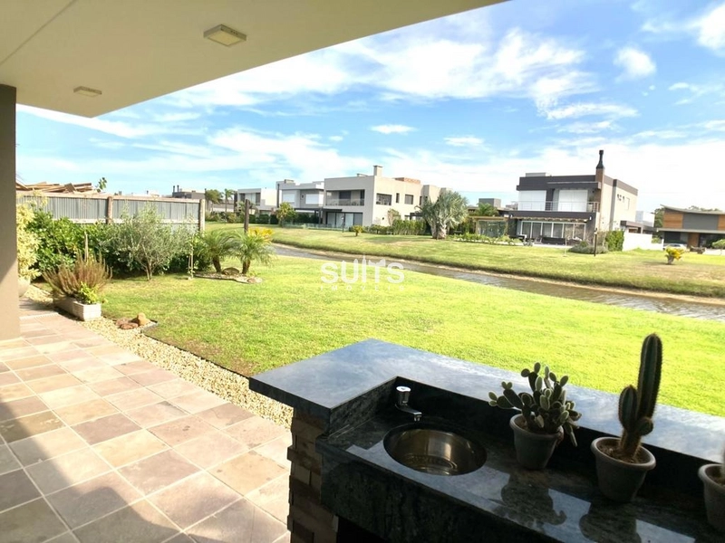 Magnífico sobrado à venda no condomínio Villaggio em Atlântida: 38ª foto da galeria de imagens do imóvel