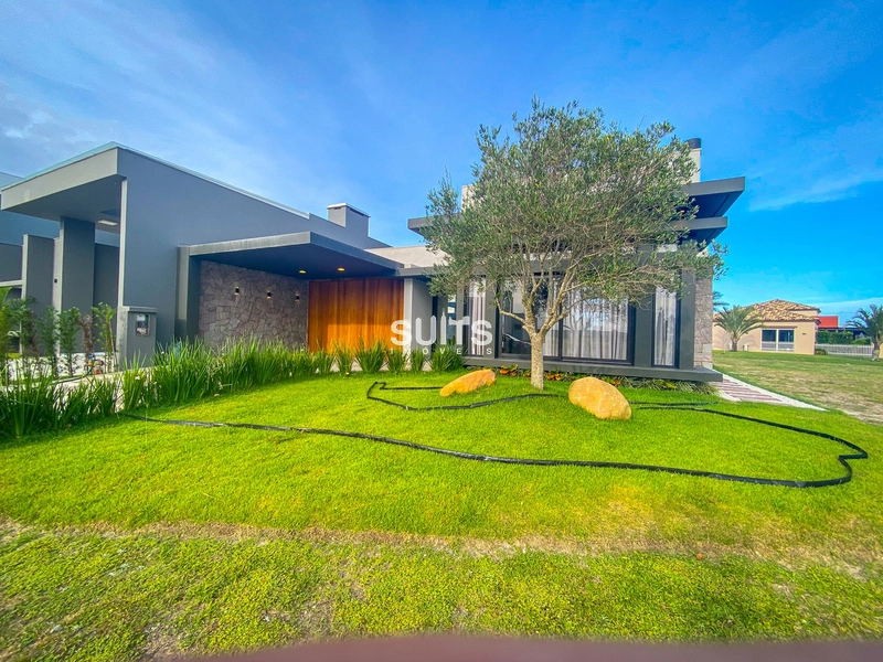 Excelente casa térrea à venda no condomínio Riviera em Xangri-lá: 1ª foto da galeria de imagens do imóvel