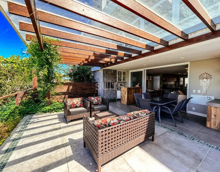 Lindo giardino beira lago no condomínio Rossi em Atlântida: 39ª foto da galeria de imagens do imóvel