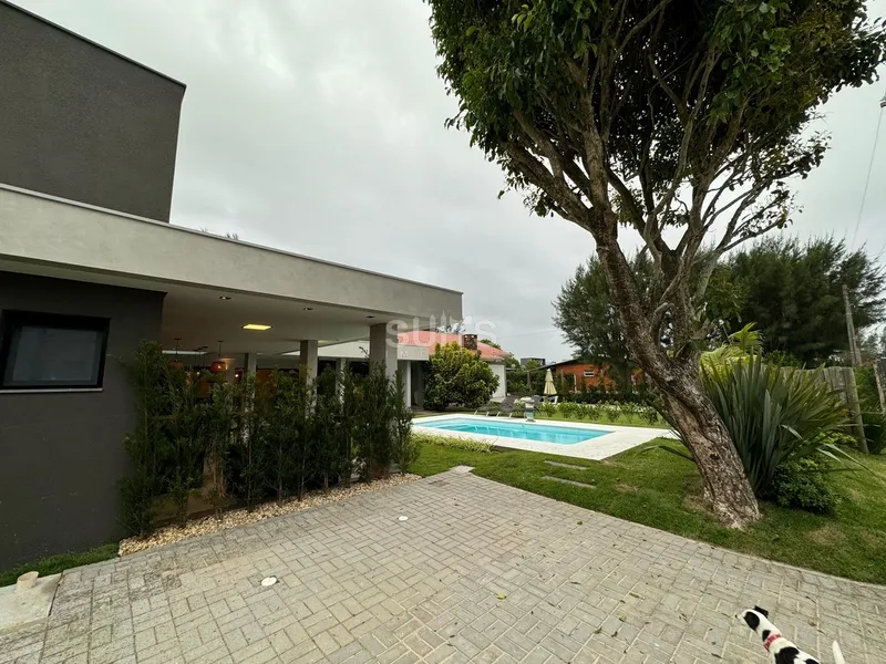 Excelente casa com 02 terrenos próxima do mar no centro de Xangri-Lá: 4ª foto da galeria de imagens do imóvel