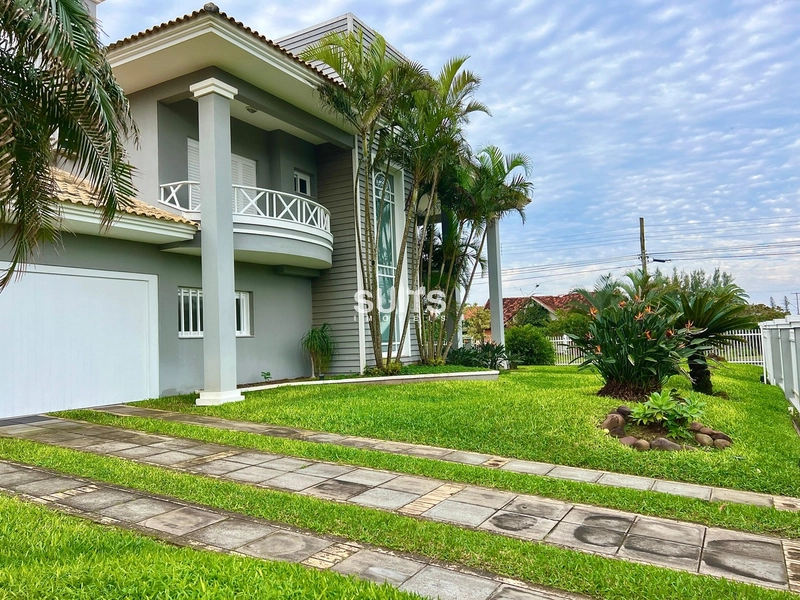 Excelente sobrado de esquina na praia de Atlântida: 2ª foto da galeria de imagens do imóvel