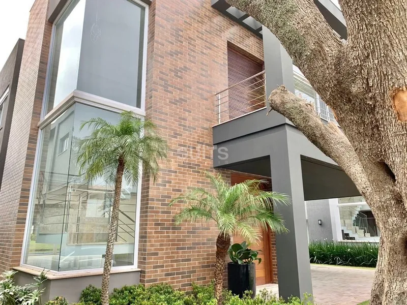 Lindo sobrado beira lago no condomínio Enseada: 2ª foto da galeria de imagens do imóvel