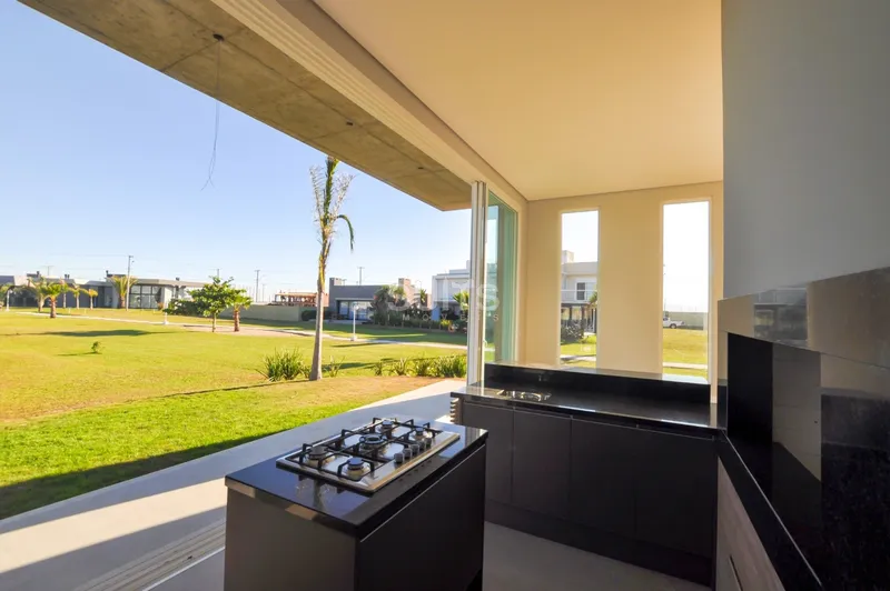 Excelente casa com lote diferenciado no condomínio Riviera: 10ª foto da galeria de imagens do imóvel