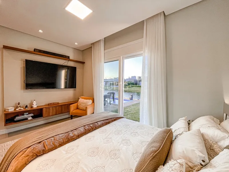 Incrível casa beira lago no condomínio Riviera: 39ª foto da galeria de imagens do imóvel