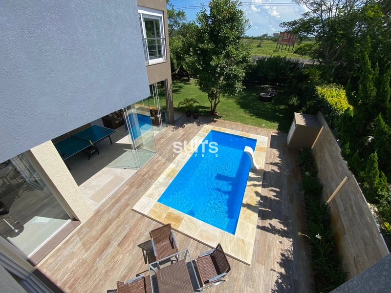 Excelente sobrado à venda no condomínio Bosques em Atlântida: 33ª foto da galeria de imagens do imóvel