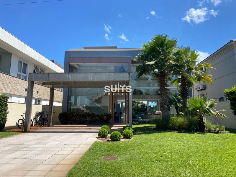 Excelente sobrado à venda no condomínio Bosques em Atlântida: 1ª foto da galeria de imagens do imóvel