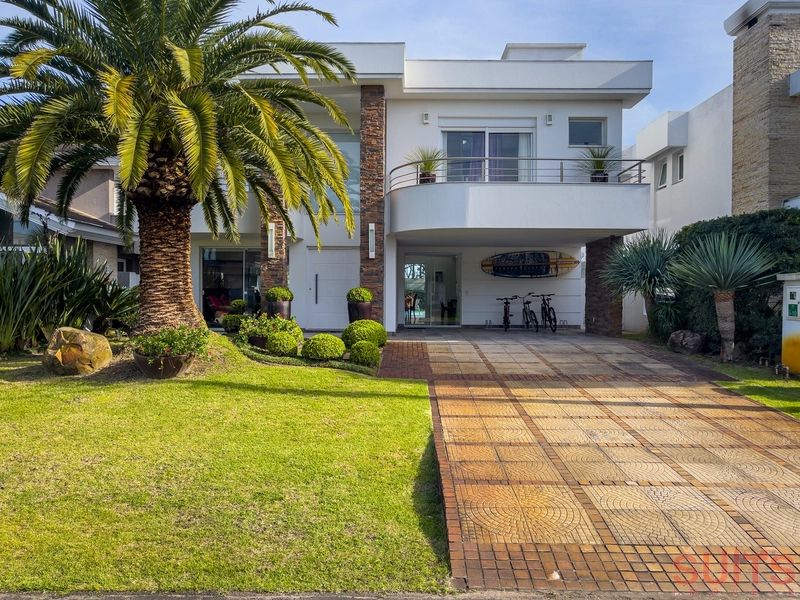 Ótima casa à venda no condomínio Bosques de Atlântida: 1ª foto da galeria de imagens do imóvel