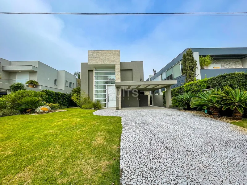 Belo sobrado no condomínio Bosques de Atlântida: 2ª foto da galeria de imagens do imóvel