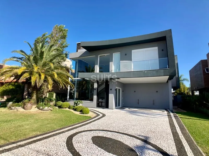 Incrível sobrado beira lago no condomínio Villaggio em Atlântida: 1ª foto da galeria de imagens do imóvel