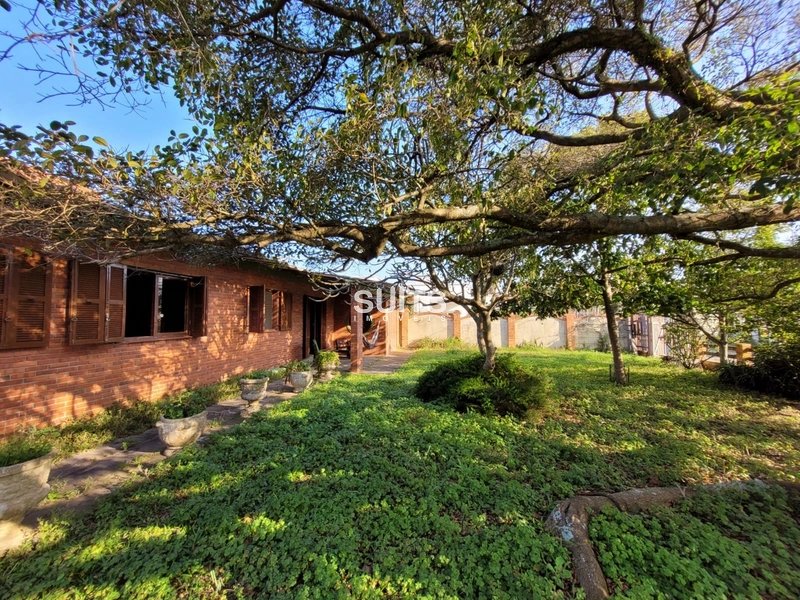 Casa com 02 terrenos na praia de Atlântida: 1ª foto da galeria de imagens do imóvel