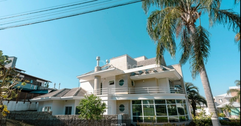 CASA EM CONDOMINIO FECHADO NO CACUPÉ: 4ª foto da galeria de imagens do imóvel