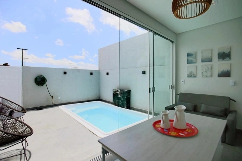 Casa com padrão único com 3 dormitórios e piscina no bairro Zona Nova: 7ª foto da galeria de imagens do imóvel