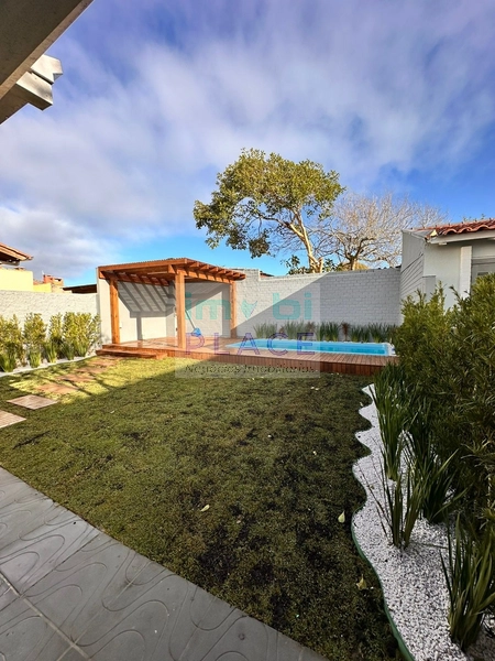 Casa ampla no Centro de Imbé – 4 dormitórios, piscina e espaço gourmet: 7ª foto da galeria de imagens do imóvel