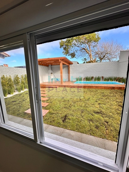 Casa ampla no Centro de Imbé – 4 dormitórios, piscina e espaço gourmet: 14ª foto da galeria de imagens do imóvel