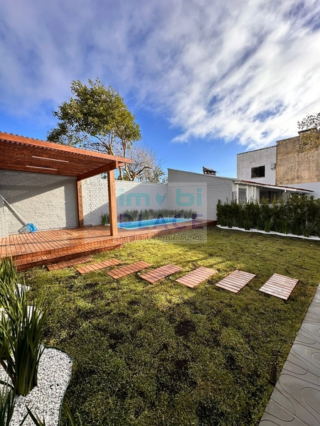 Casa ampla no Centro de Imbé – 4 dormitórios, piscina e espaço gourmet: 5ª foto da galeria de imagens do imóvel