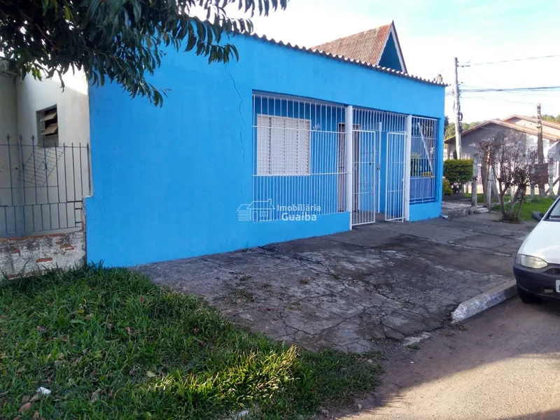 Terreno de esquina com casas: 2ª foto da galeria de imagens do imóvel