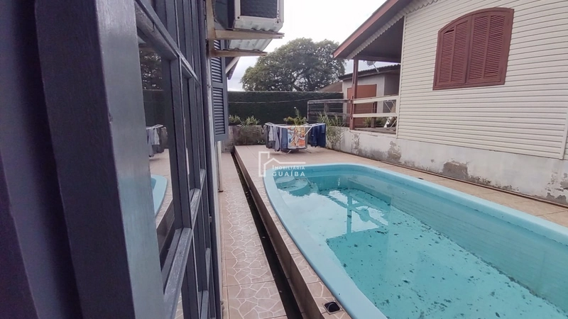 Casa de 3 dormitórios com piscina: 20ª foto da galeria de imagens do imóvel