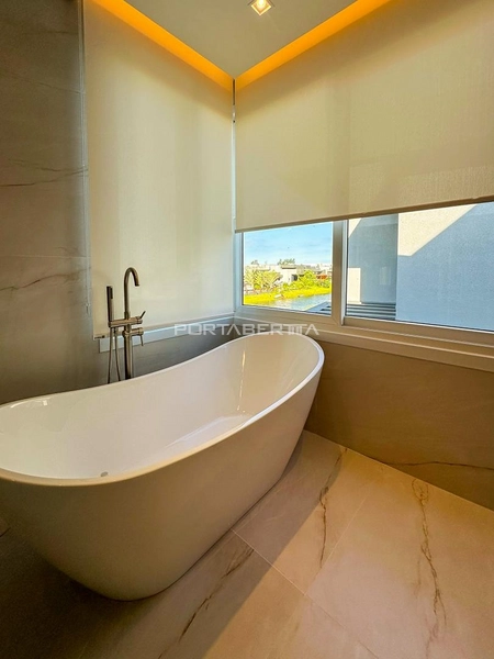 Casa com 04 suítes no condomínio Riviera em Xangri-lá RS: 3ª foto da galeria de imagens do imóvel