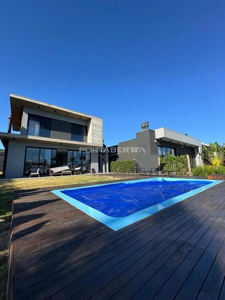 Casa com 04 suítes no condomínio Riviera em Xangri-lá RS: 2ª foto da galeria de imagens do imóvel