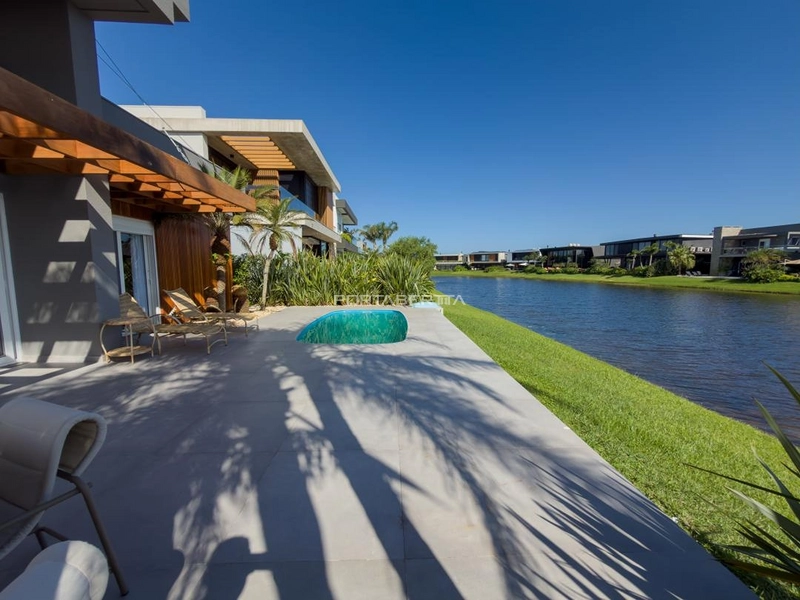 Casa térrea beira lago, mobiliada e decorada, condomínio Enseada.: 21ª foto da galeria de imagens do imóvel