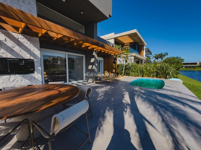 Casa térrea beira lago, mobiliada e decorada, condomínio Enseada.: 22ª foto da galeria de imagens do imóvel