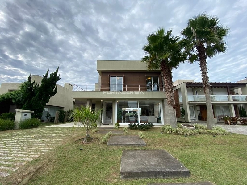 Casa com 05 dormitórios no condomínio Ventura em Xangri-lá RS: 1ª foto da galeria de imagens do imóvel