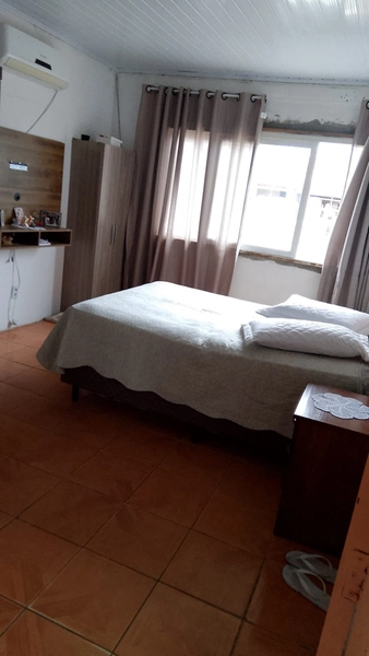 Casa Ampla e Bem Localizada com 3 Dormitórios e Pátio Livre: 12ª foto da galeria de imagens do imóvel